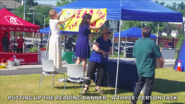 Putting up the reading banner - a three-person task