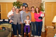 The family in front of fireplace